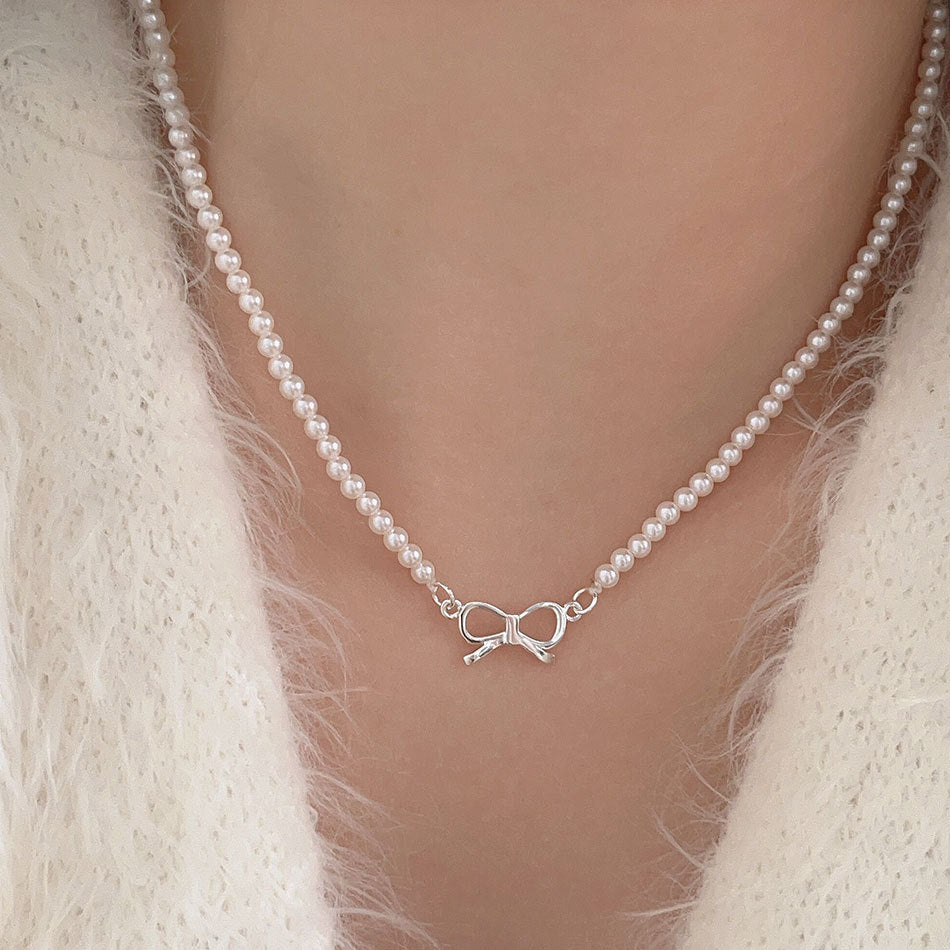 Minimalist Bowknot Pendant Necklace in 925 Sterling Silver with Rhinestone and Pearl Accents on Cross Chain