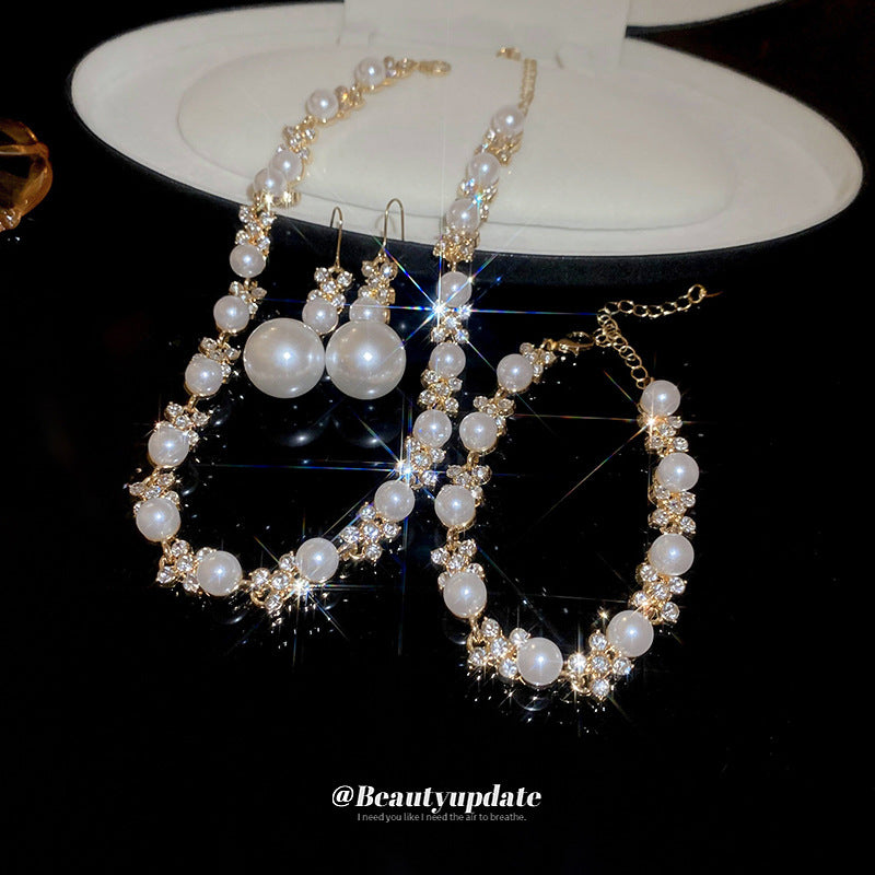 Elegante juego de collar redondo de perlas florales con incrustaciones de circonita para mujer, incluye pendientes, pulsera y cadena de clavícula