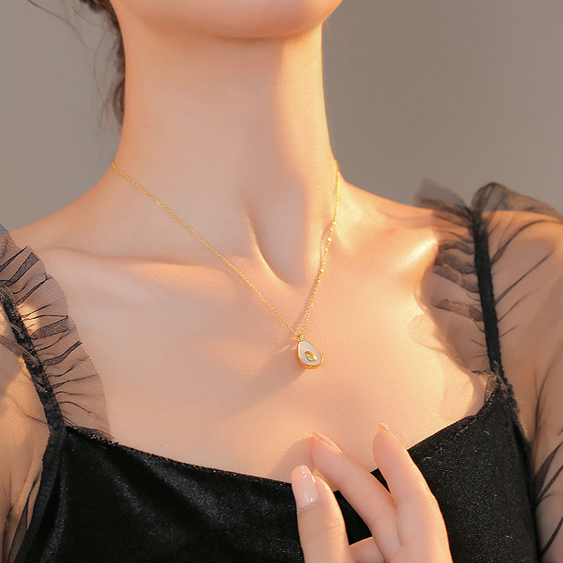 Minimalist Avocado Shell Pendant Necklace for Women in Titanium Steel with Gold Plating on Cross Chain