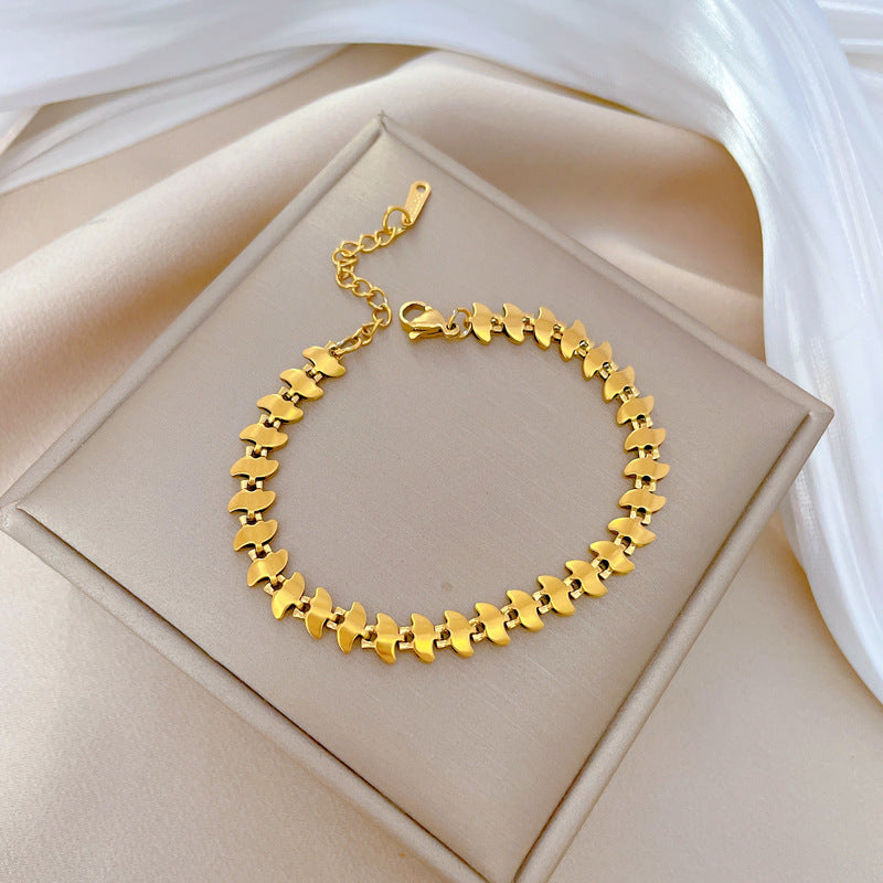 Minimalist Dart-Shaped Titanium Steel Bracelet for Women with Gold Plating and Wavy Texture