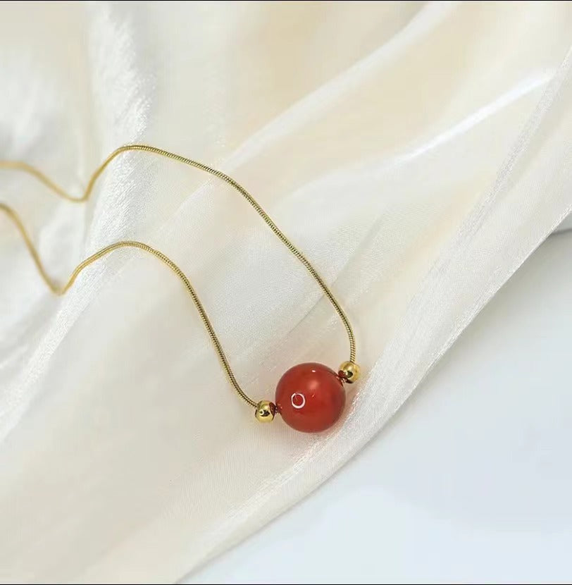 Geometric Titanium Steel Snake Chain Necklace with Gold-Plated Lucky Bean Pendant and Genuine Agate Beads
