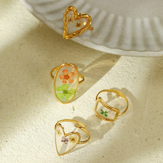 Elegante anillo de acero de titanio con diseño floral y acabado esmaltado para mujer, estilo de lujo minimalista con banda ajustable