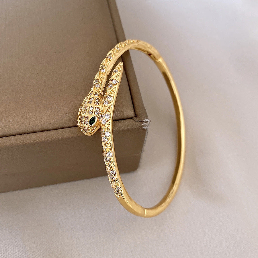 Pulsera tipo brazalete de aleación de cobre bañada en oro de lujo con incrustaciones de diamantes de imitación para mujer
