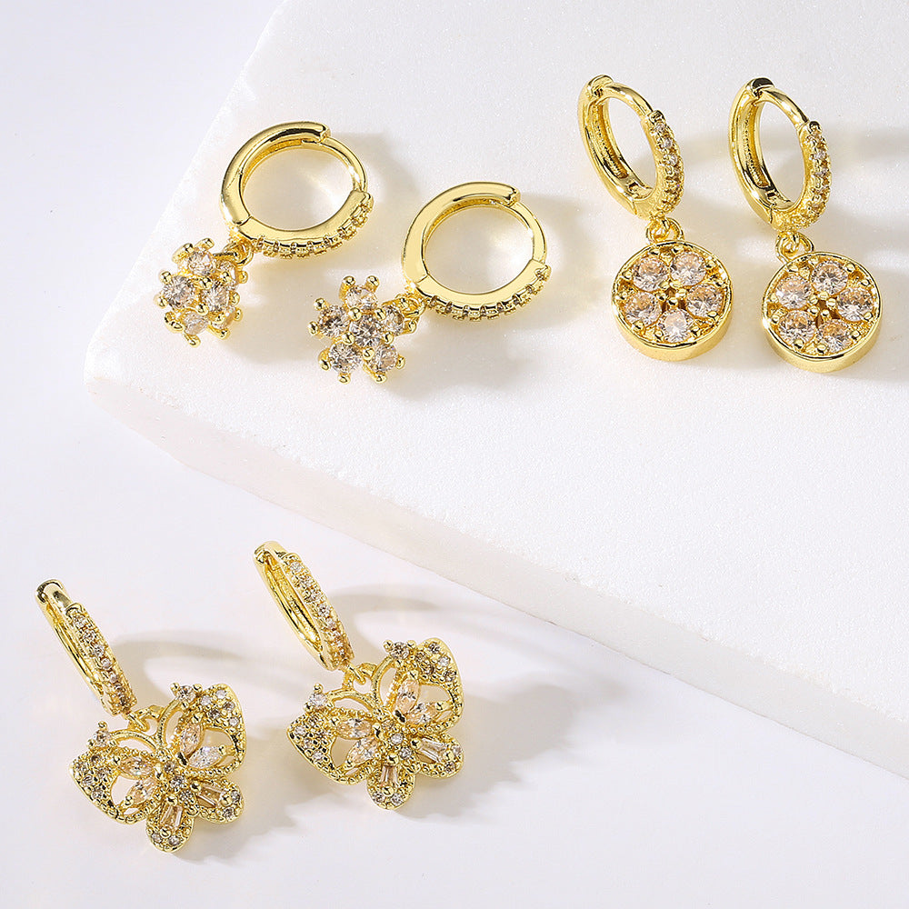 Orecchini a farfalla alla moda in rame placcati oro 18 carati con intarsio di zirconi per donna