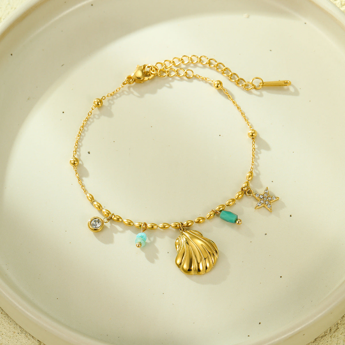 Fashionable Ocean-Inspired Shell and Star-Shaped Titanium Steel Bracelet with Zircon Inlay and 18K Gold Plating for Women