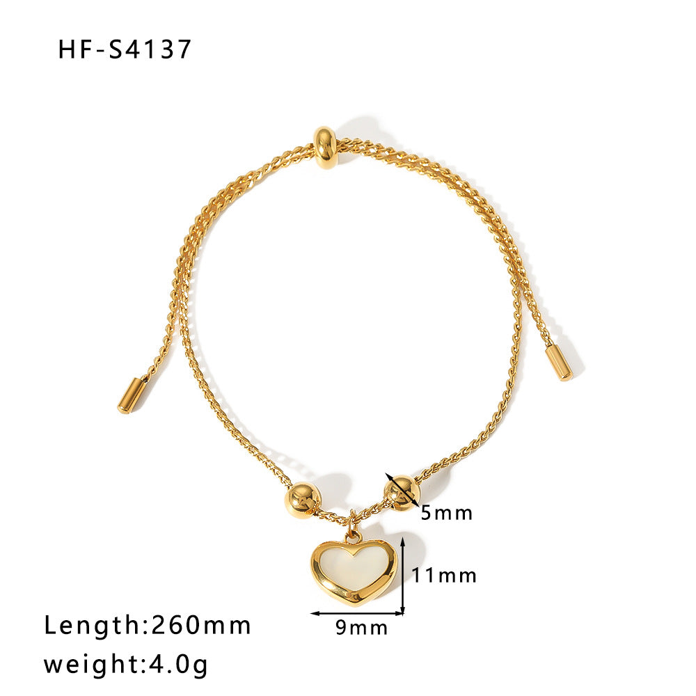 Bracciale regolabile minimalista retrò francese a forma di cuore con abalone bianco, dettagli geometrici e acciaio inossidabile placcato sottovuoto in oro 18 carati