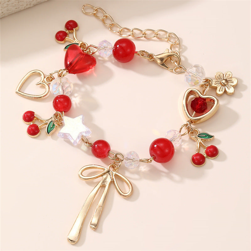 Pulsera con dije de lazo de corazón de cereza dulce para niñas, hecha de resina con detalles artesanales