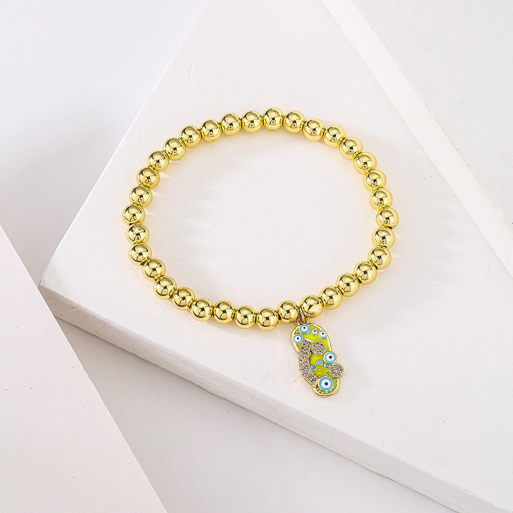 Minimalist Geometric Pendant Bracelet for Women with 18K Gold Plated Copper Beads and Enamel Zirconia Slipper Charm