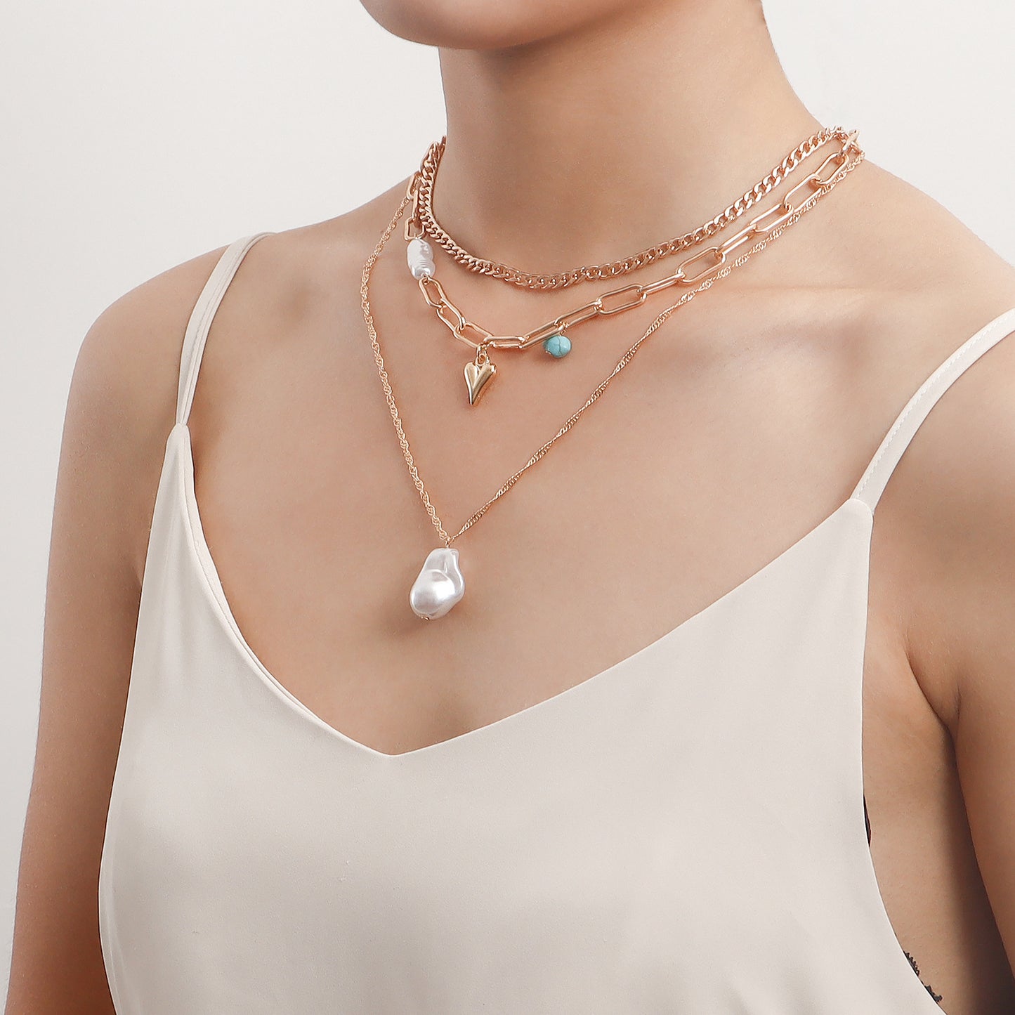 Trendy Multi-Layer Asymmetrical Pearl-Effect Heart Pendant Necklace for Women in Alloy with Plated Finish