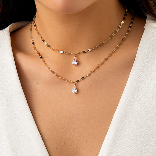 Collana da donna a doppio strato minimalista a forma di goccia con barra in metallo galvanizzato e pendente a cuore micro-pavé su catena O-ring