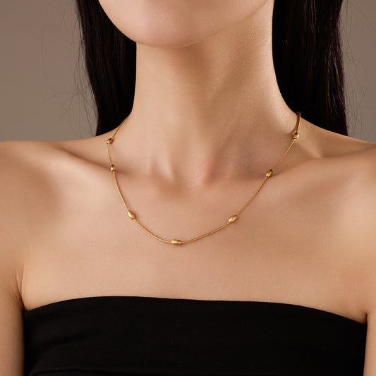 Collana a Clavicola con Sfera in Acciaio al Titanio, Minimalista ed Elegante, da Donna con Finitura Placcata