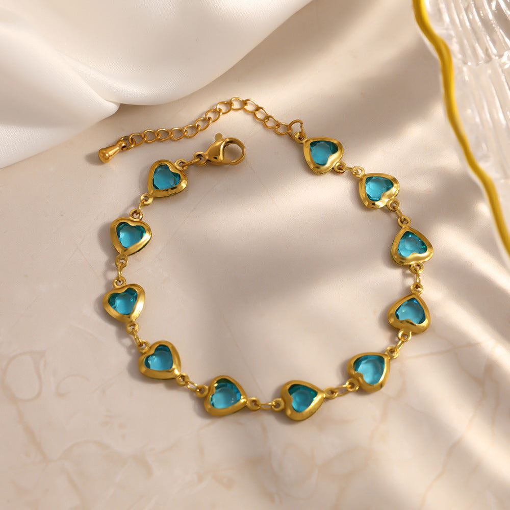 Elegante bracciale da donna in acciaio inossidabile placcato oro 18 carati a forma di cuore con intarsio di cristalli colorati