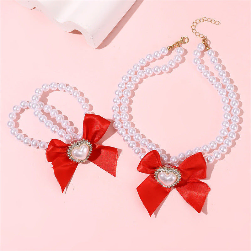 Elegante collar de perlas de doble capa para niñas con lazo y colgante de corazón en estilo estético crema, joyería de resina