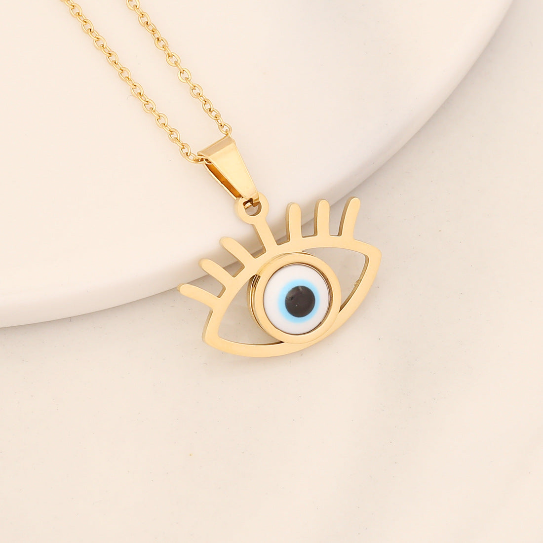 Collana con pendente a forma di occhio in acciaio inossidabile audace con finitura a olio a goccia