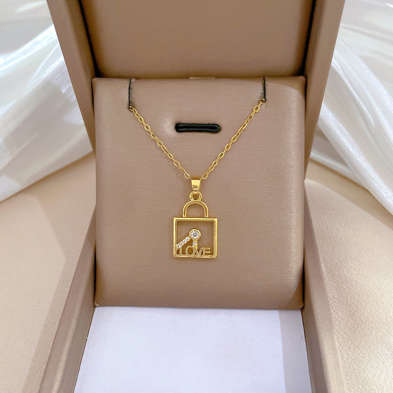 Minimalist Geometric LOVE Key Lock Pendant Necklace for Women and Men in Titanium Steel with Rhinestone Accents on Snake Chain