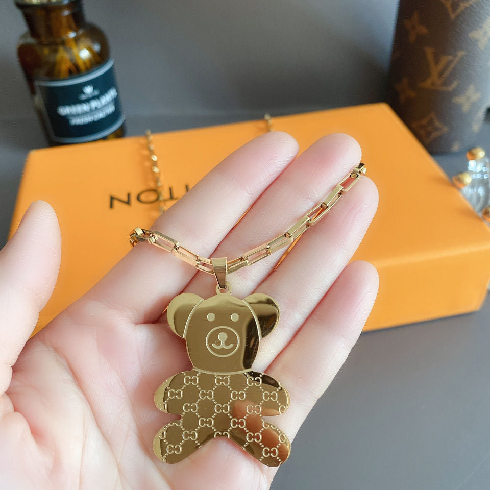 Collana con ciondolo a orso minimalista in acciaio al titanio con finitura placcata, catena a onda d'acqua, design geometrico, accessorio di moda unisex