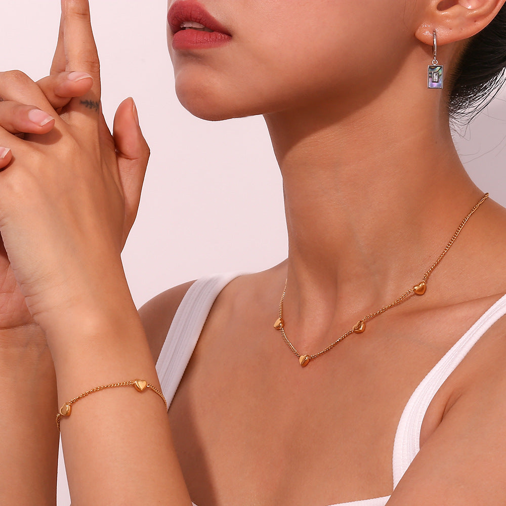 Moderno juego de pulsera y collar de acero inoxidable con forma de corazón chapado en oro de 18 quilates para mujer