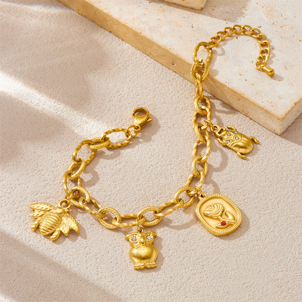 Bracciale alla moda con ciondoli a forma di gufo, ape, coccinella e rosa in acciaio inossidabile placcato oro 18K