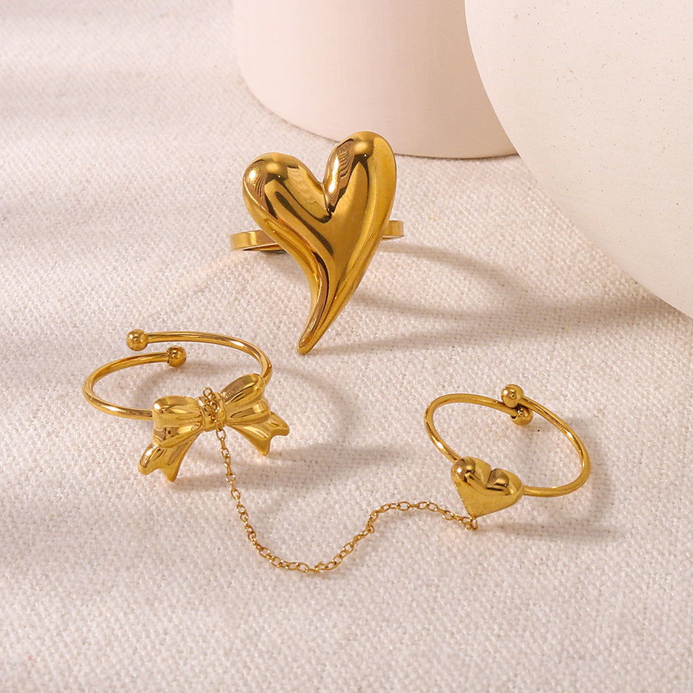 Anello minimalista a forma di fiocco e cuore in acciaio inossidabile con placcatura sottovuoto per uomo e donna
