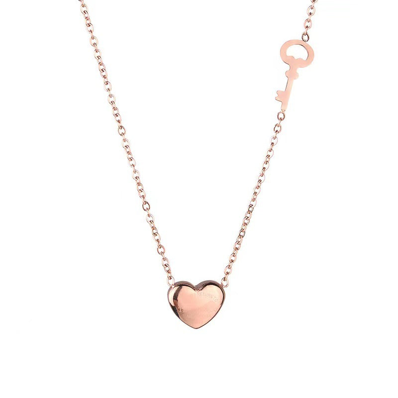 Collana da donna con ciondolo a cuore tridimensionale minimalista in acciaio al titanio placcato in oro rosa 18 carati su catena a maglie sferiche