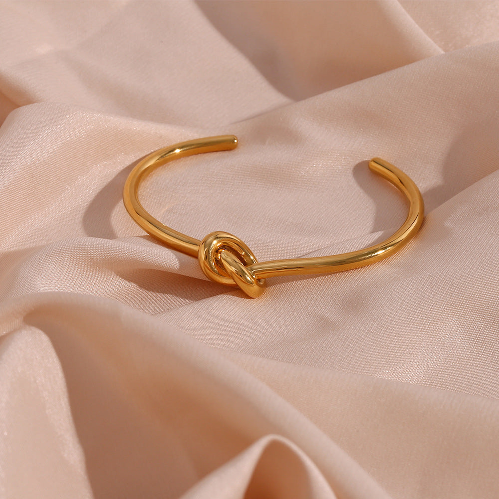 Bracciale da donna placcato oro 18 carati in acciaio inossidabile dal design minimalista a nodo