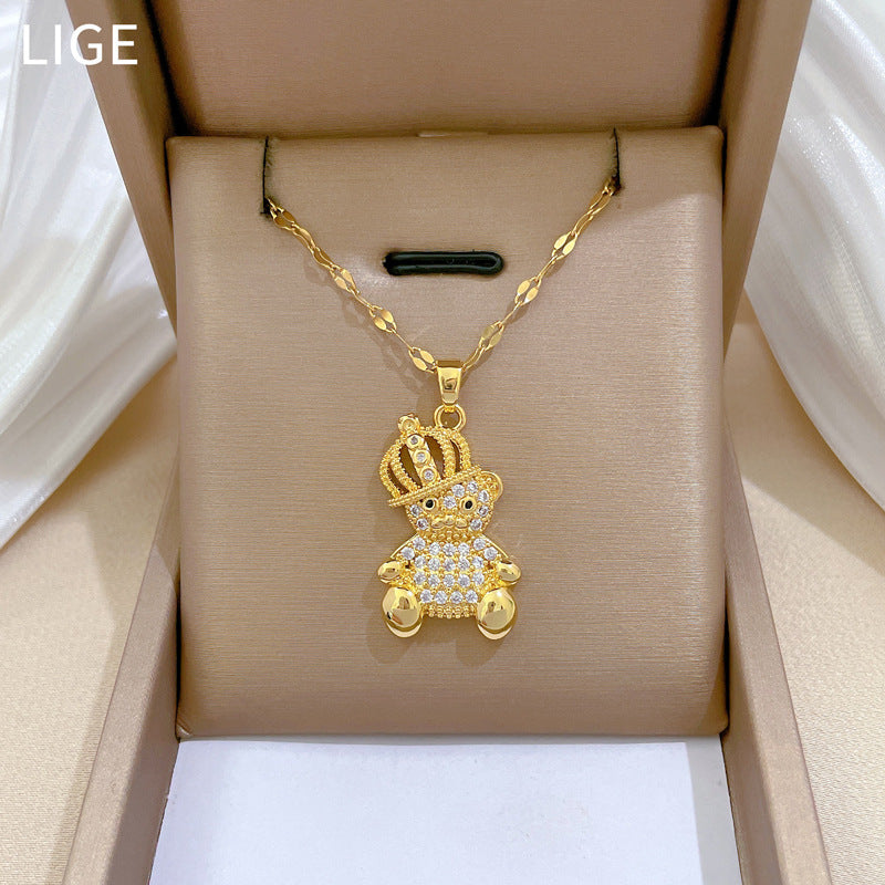Collar con colgante de oso minimalista con diseño de corona de circonitas en acero de titanio para mujer y hombre