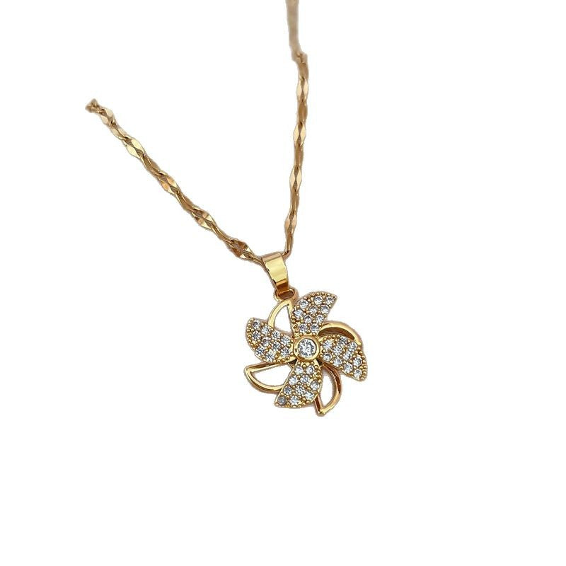 Collana con ciondolo a mulino a vento girevole da donna con design cavo e strass completi in acciaio al titanio, catena a medaglione in stile geometrico minimalista