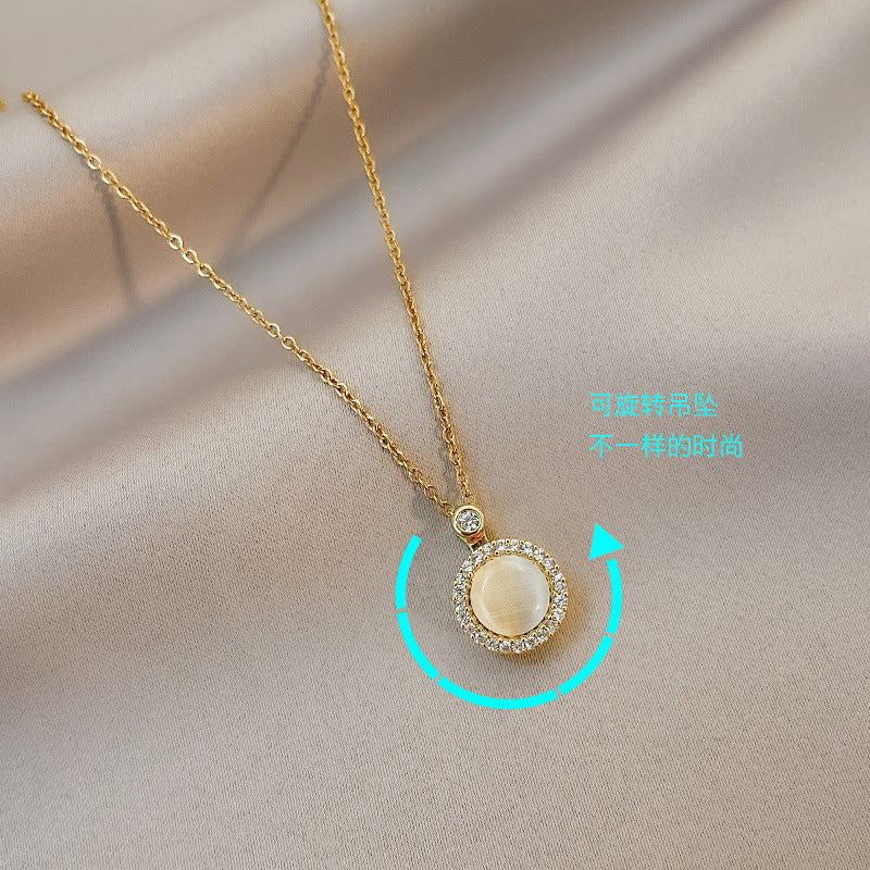 Collana girocollo minimalista da donna con pendente a occhio di gatto rotante, zirconi micro-pavé, design geometrico rotondo in acciaio al titanio con catena a croce