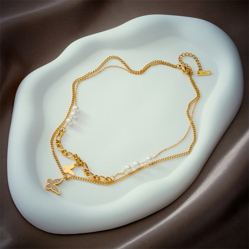 Collana da donna in acciaio al titanio con ciondolo a farfalla con perline irregolari a doppio strato in stile vintage
