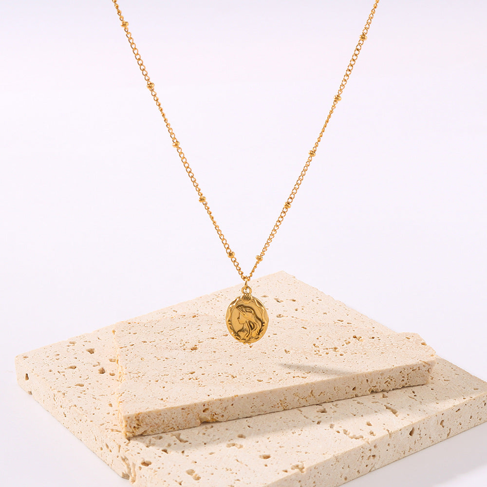 Collana da donna a doppio lato con sirena minimalista in acciaio al titanio, con catena a maglie in oro