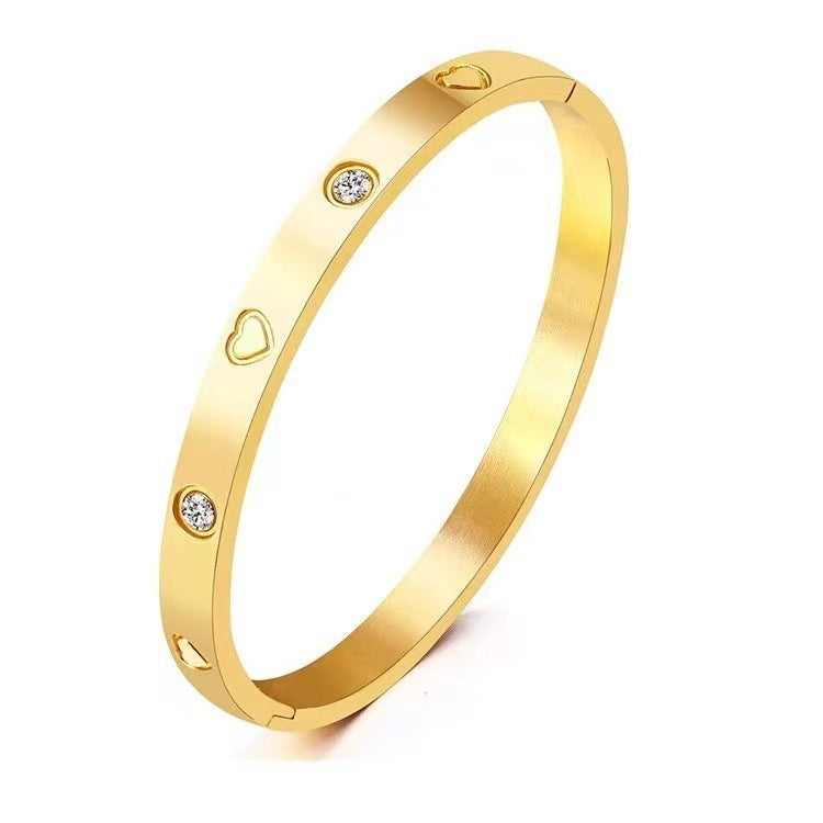 Bracciale alla moda in acciaio al titanio a forma di cuore con intarsi in strass e finitura galvanizzata da donna