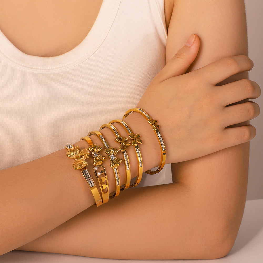 Asymmetrical Bow-Shaped Stainless Steel Bracelet for Women with Zircon Inlay and 18K Gold Plating