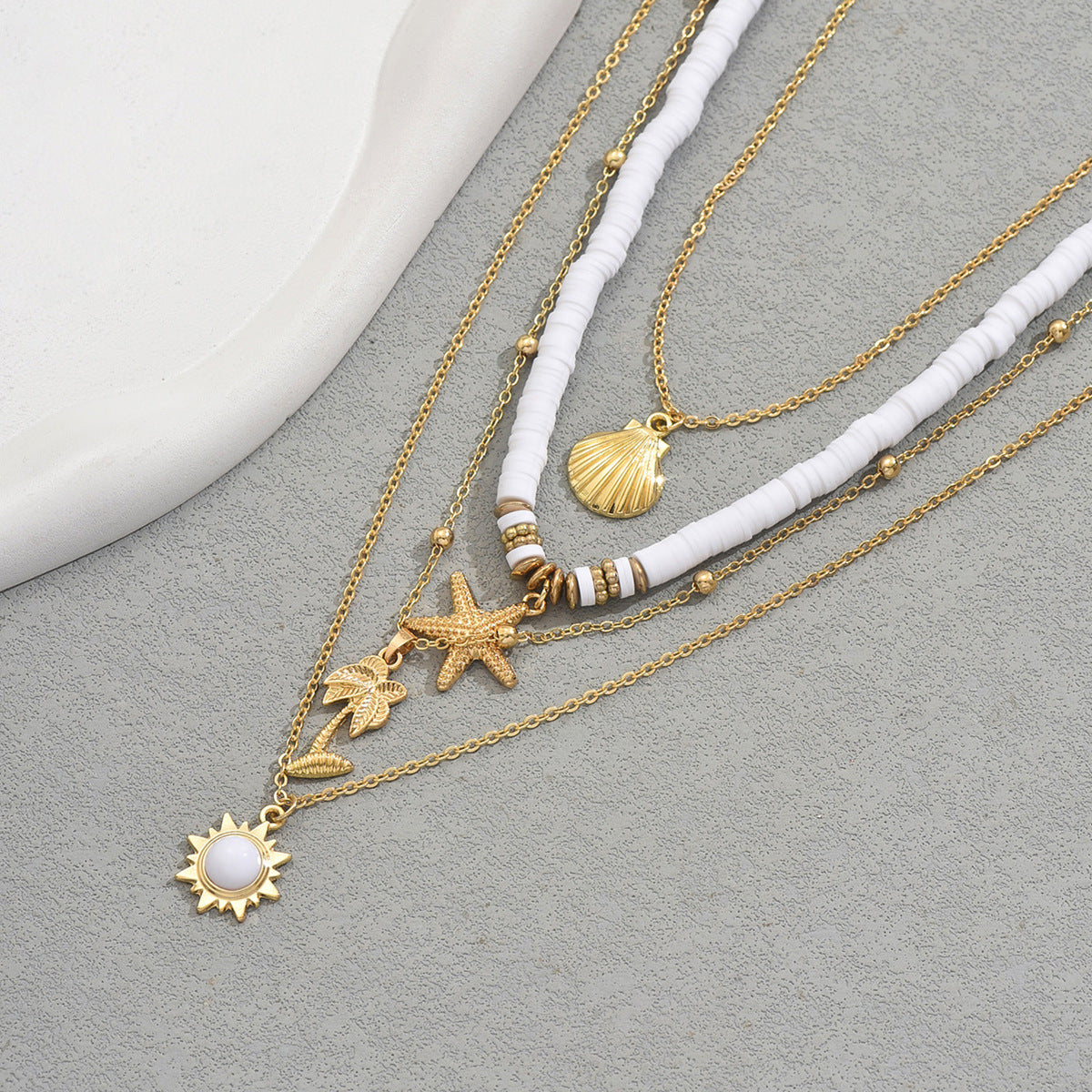 Collar colgante de estrella de mar y concha geométrica de aleación de zinc con cadena de clavícula multicapa tejida a mano para mujer