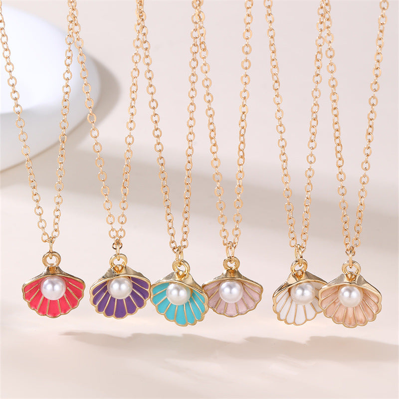 Dulce Collar con Colgante de Mariposa y Lazo Fresco para Niñas con Dije de Concha con Perlas de Aleación y Acabado Esmaltado Artesanal