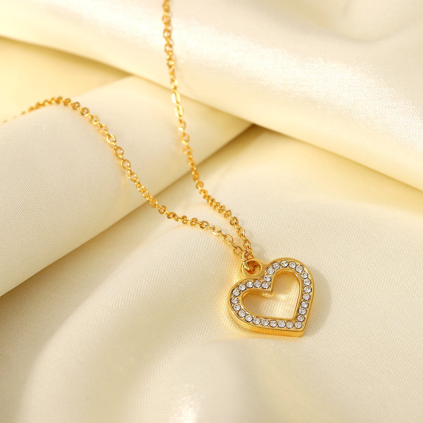 Ins Style Heart Shaped Stainless Steel Necklace with Vacuum Plated 18K Gold Finish and Hollow Design Featuring Clear Zirconia Accents for Women
