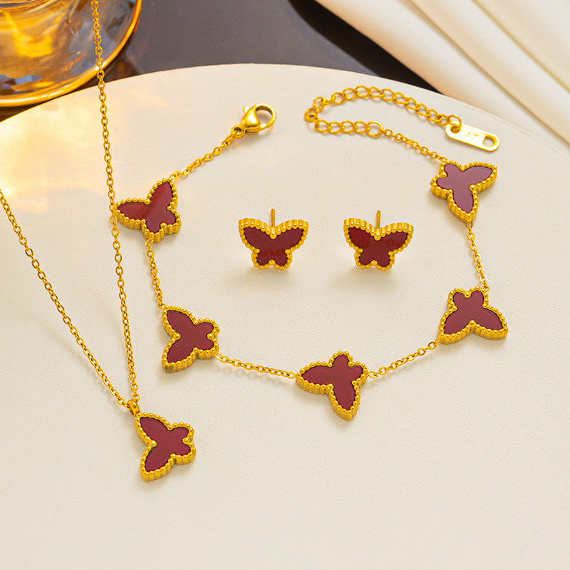Set di collana, orecchini e bracciale minimalista con farfalla in acciaio al titanio con finitura placcata