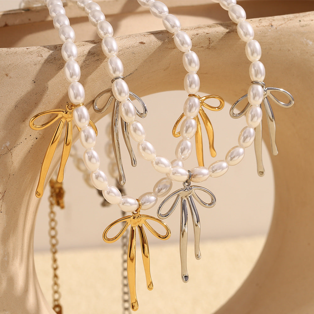 Fashionable Bowknot Pendant Necklace for Women in Stainless Steel with 18K Gold Plating and Imitation Pearl Accent