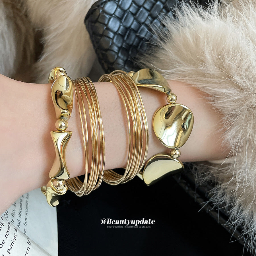 Bracciale rigido aperto attorcigliato lucido da donna Accessorio di moda in lega metallica con design geometrico