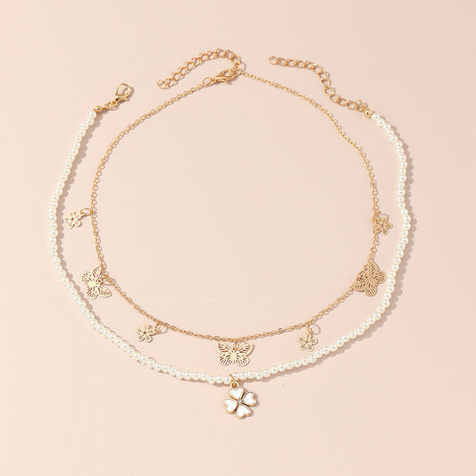 Set di collane in lega a forma di farfalla minimalista con catena di perle per ragazze dai 6 anni in su, ciondolo a trifoglio perlato