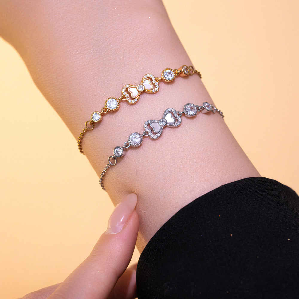 Elegant Butterfly Knot Shaped Titanium Steel Bracelet with Rhinestone Inlay and Gold Plating for Women