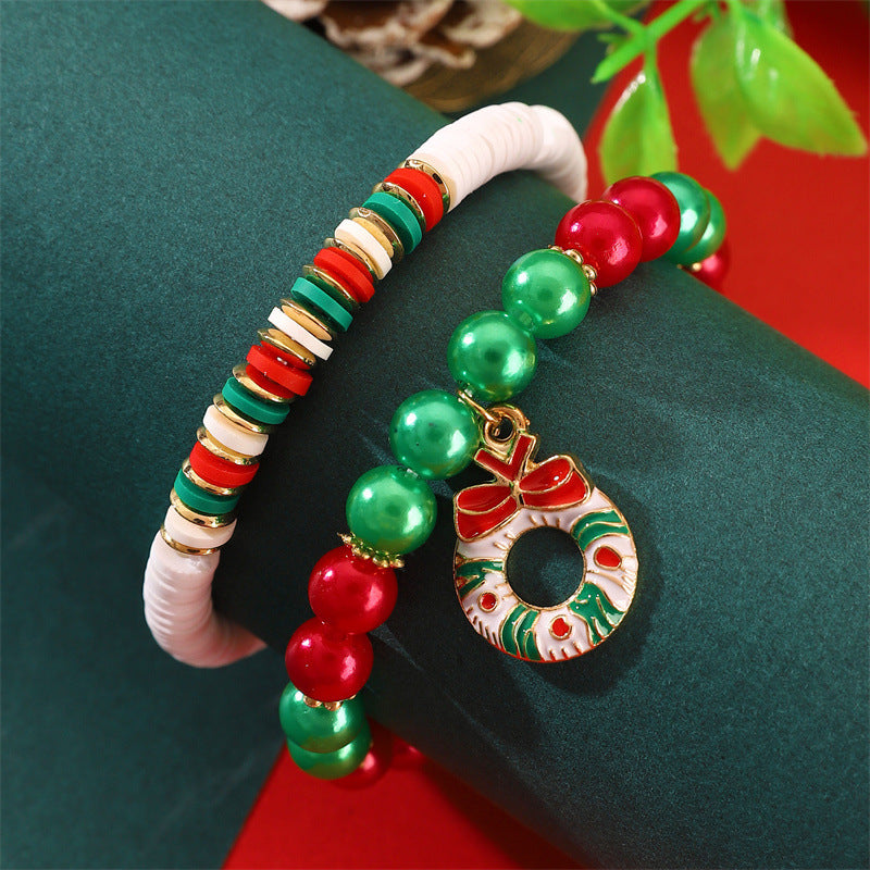 Set di bracciali natalizi fatti a mano in argilla polimerica da donna con ciondoli di Babbo Natale e fiocchi di neve in stile cartone animato giocoso