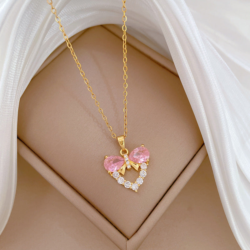 Collana da donna minimalista con fiocco e zirconi a forma di cuore, in acciaio inossidabile, catena delicata per clavicola