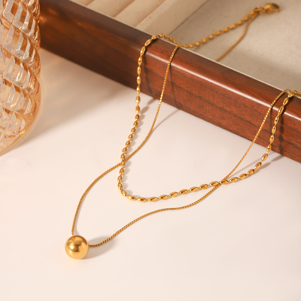 Minimalist Geometric Gold-Tone Stainless Steel Double-Layer Necklace with Small Spherical Pendant and Twisted Chain