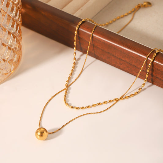 Collar minimalista geométrico de doble capa de acero inoxidable dorado con pequeño colgante esférico y cadena retorcida