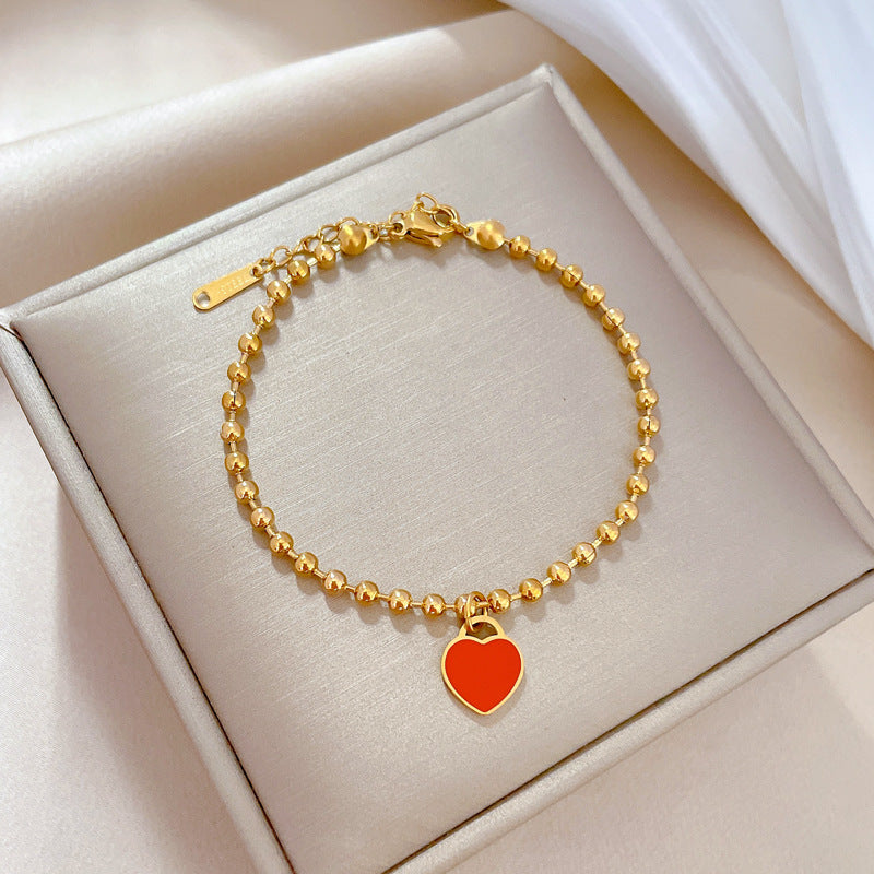 Bracciale da donna vintage bohémien a forma di cuore in acciaio al titanio placcato oro con texture ondulata