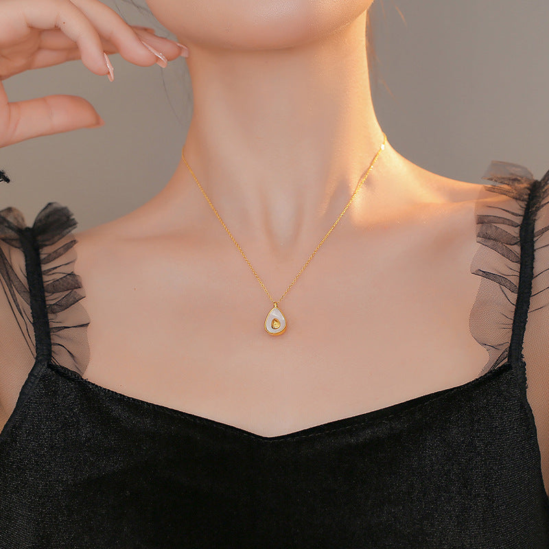 Minimalist Avocado Shell Pendant Necklace for Women in Titanium Steel with Gold Plating on Cross Chain