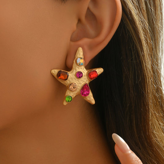 Pendientes de tuerca de aleación de zinc en forma de estrella de moda con incrustaciones de diamantes de imitación para mujer, diseño geométrico con postes de acero inoxidable
