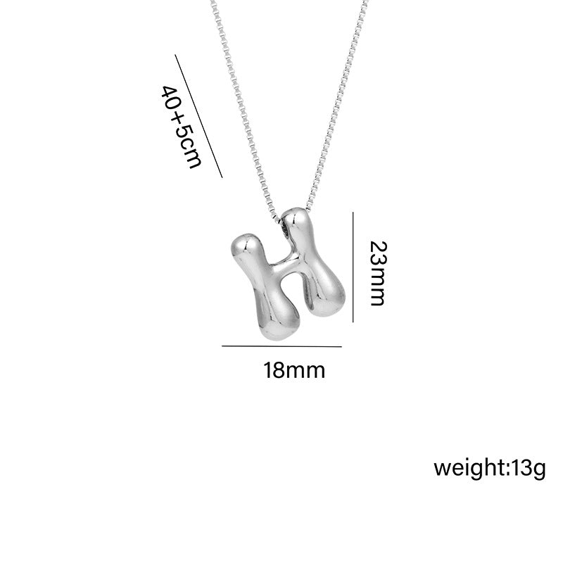 Collar con colgante de acero titanio con forma de letra minimalista y chapado en oro para mujer