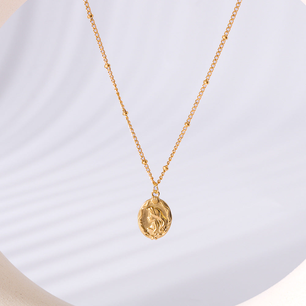 Collana da donna a doppio lato con sirena minimalista in acciaio al titanio, con catena a maglie in oro