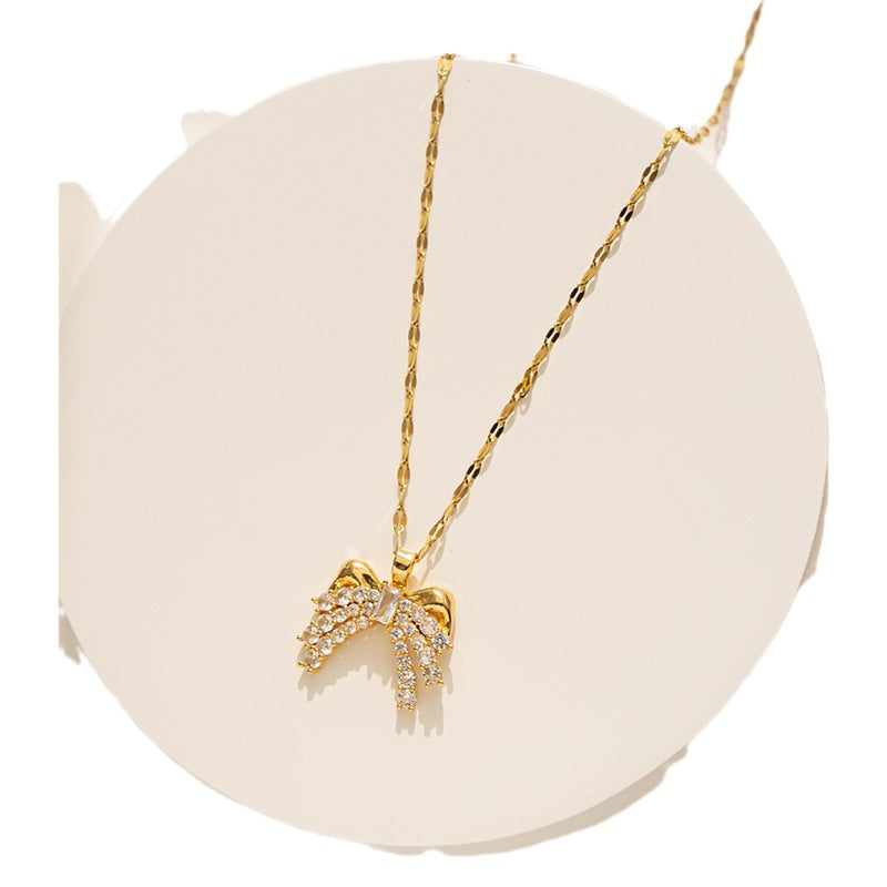 Collar minimalista con lazo para mujer, colgante de acero titanio con incrustaciones de diamantes de imitación y cadena ondulada